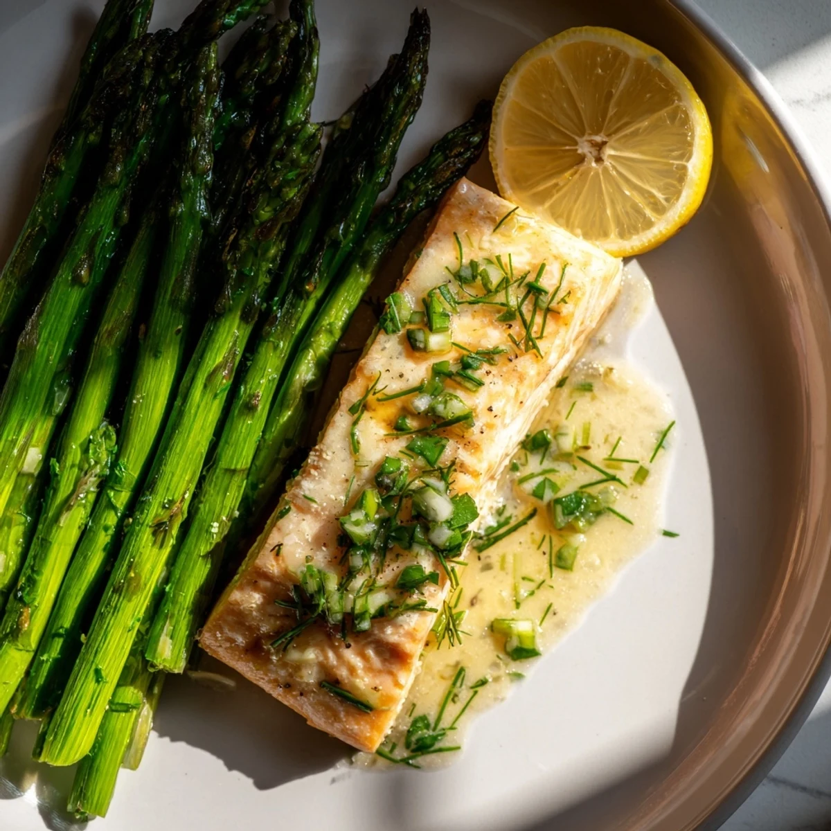 Skillet Lemon-Butter Salmon with Asparagus, golden salmon with a vibrant lemon sauce, and crisp asparagus.