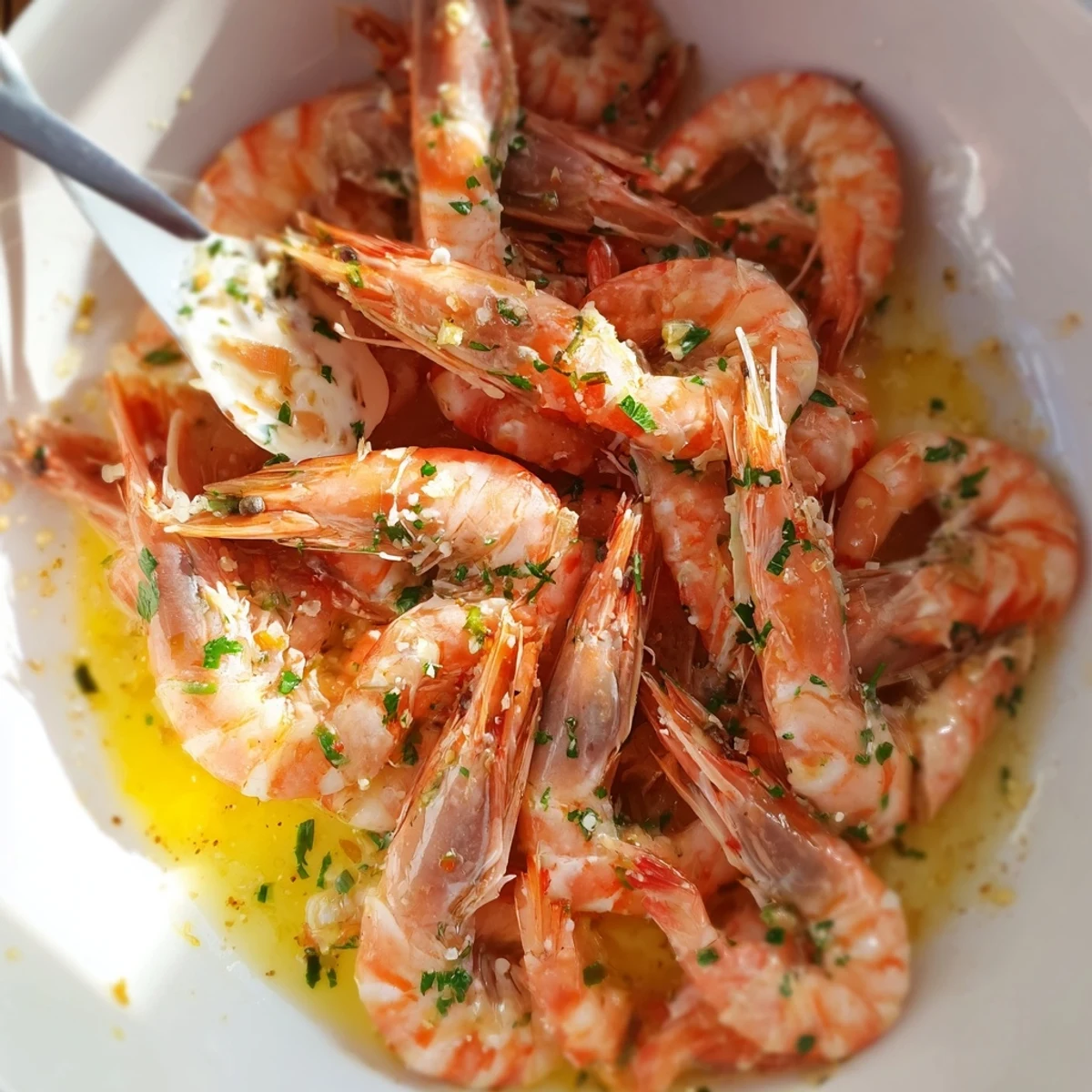 Light and bright Lemon Herb Shrimp Scampi, a glistening plate of shrimp with vibrant herbs and lemon wedges.