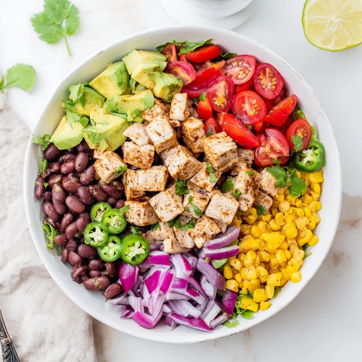 Close-up of vibrant Southwestern Bean Salad, brimming with colorful veggies, ready to serve.