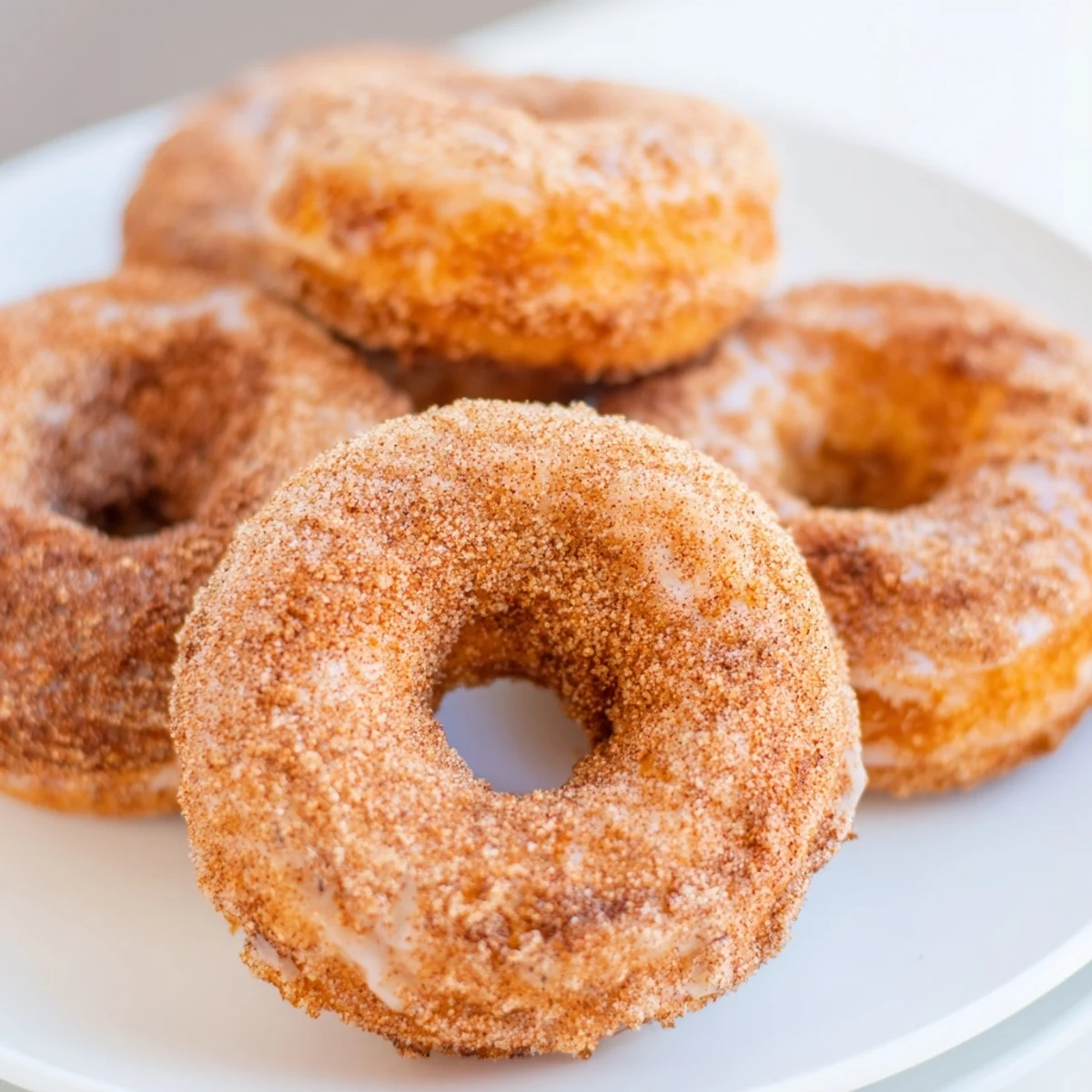 Close-up of golden brown cinnamon-sugar baked donuts, delightful and easy for any breakfast or brunch.