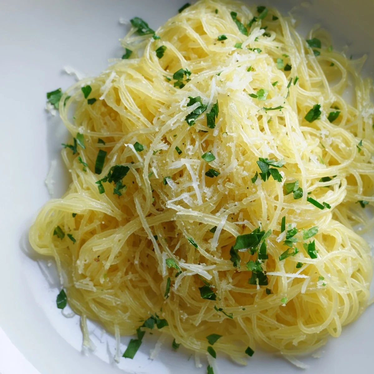 Close-up of freshly made Lemon Capellini; angel hair pasta sauced with a zesty lemon butter.