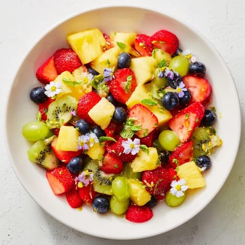 Image shows a beautiful Festive Bow Fruit Medley, chilled and bursting with juicy, refreshing flavors.