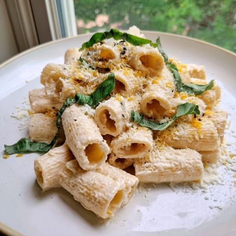 Smooth, creamy cottage cheese pasta: a quick, easy, and flavorful meal topped with Parmesan.