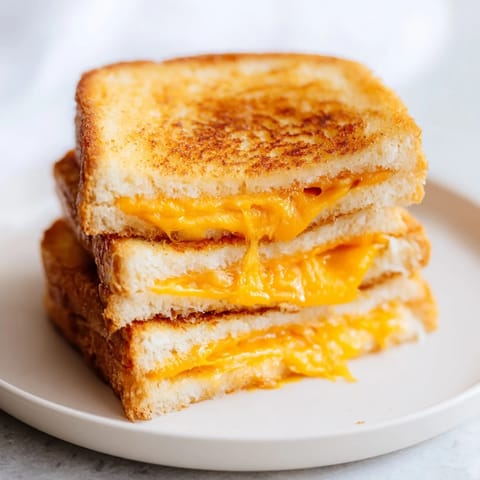 Crispy edges and melted cheddar make this Air Fryer Grilled Cheese a comforting snack.