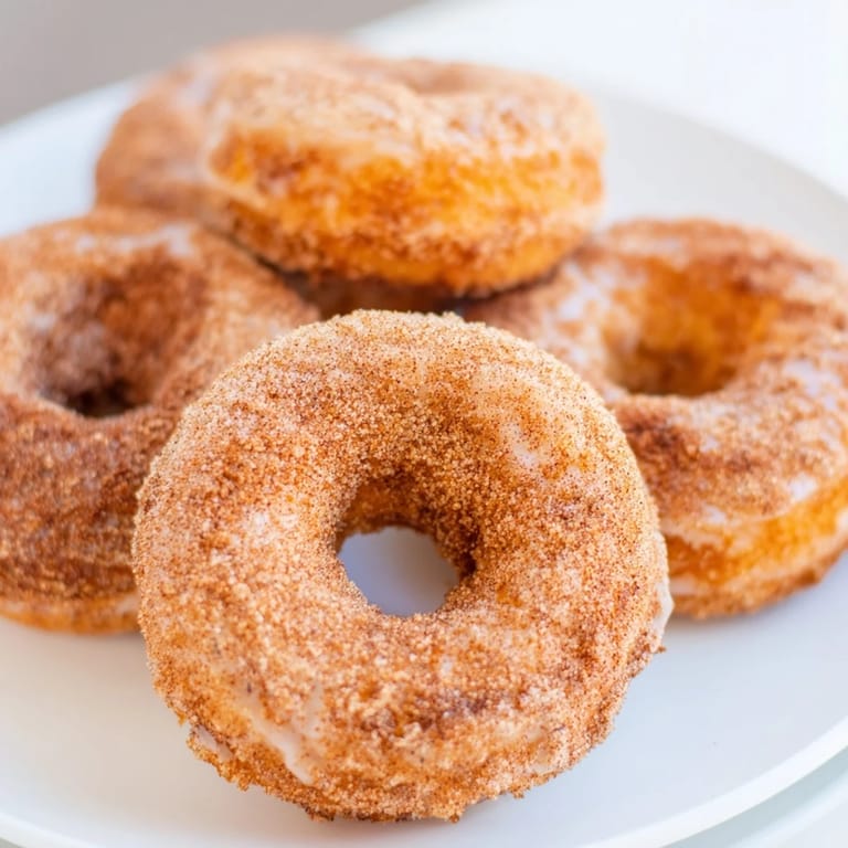 Close-up of golden brown cinnamon-sugar baked donuts, delightful and easy for any breakfast or brunch.