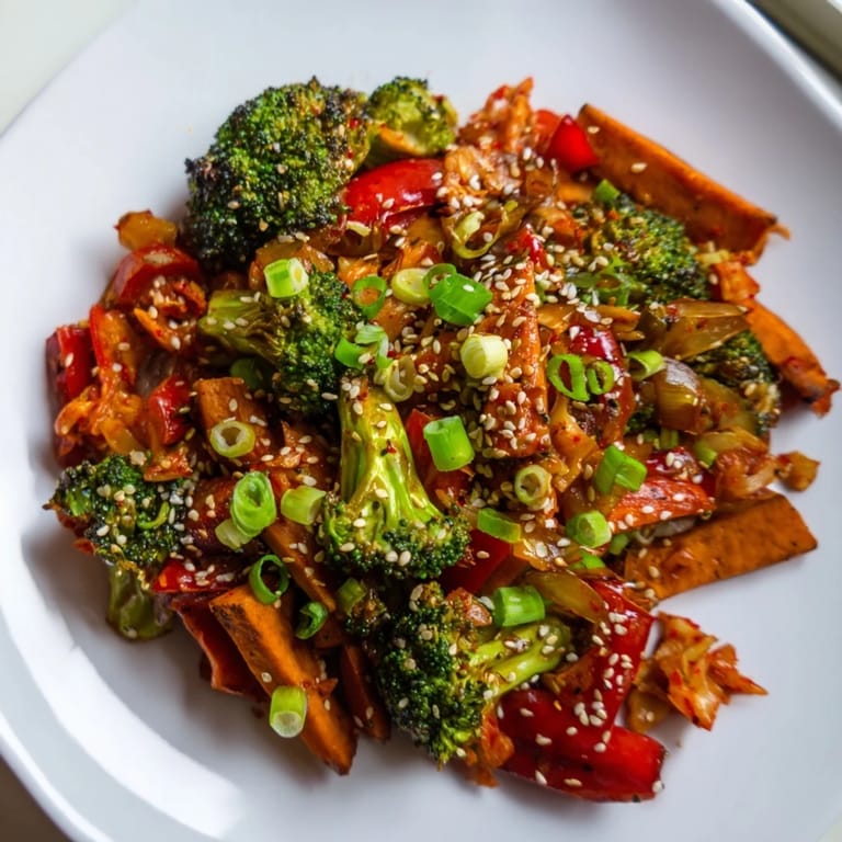 Steaming Comforting Fermented Veggie Winter Stir-Fry served in a ceramic bowl, showcasing colorful winter vegetables and crunchy kimchi, ready for a wholesome vegan dinner.