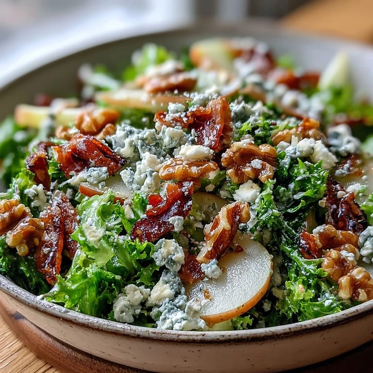A vibrant Frisée Pear Blue Cheese Bowl featuring sweet pears, tangy crumbles, and crispy prosciutto.